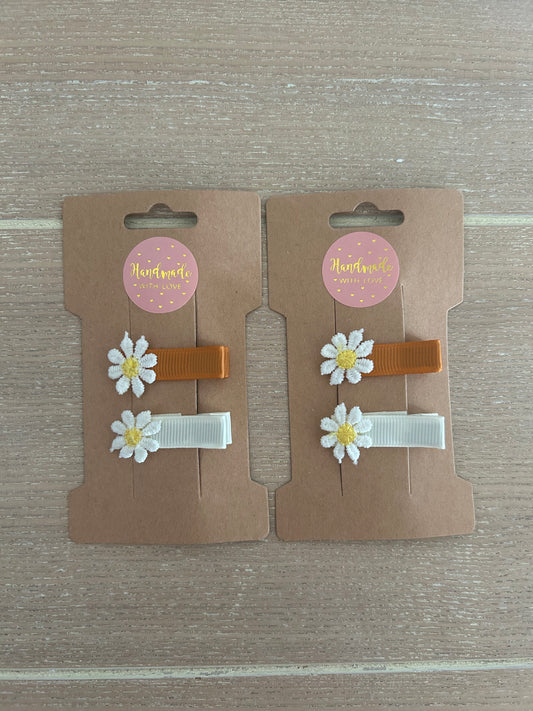 Orange and white baby Daisy clips