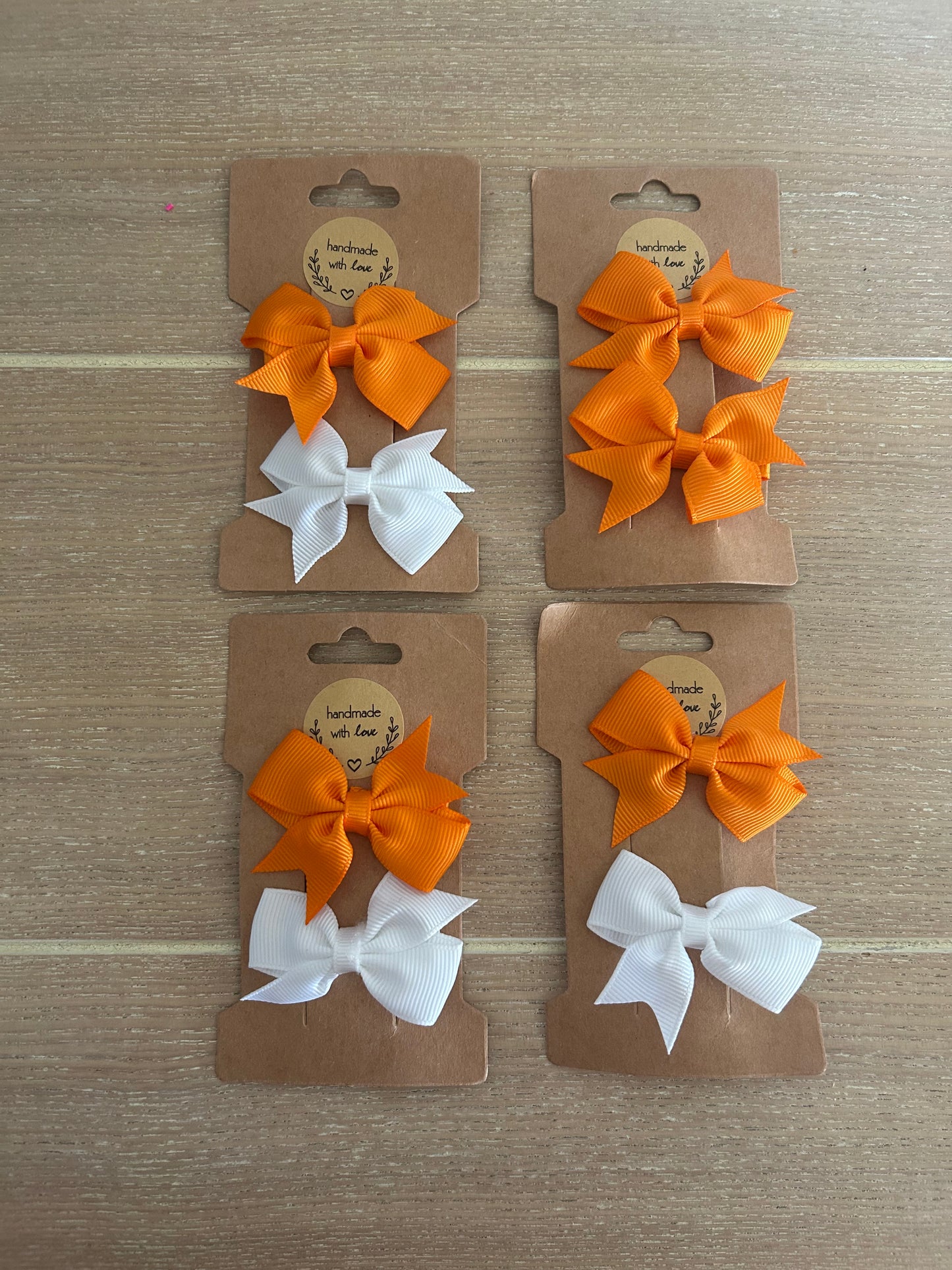 Orange and white small bow hair clips